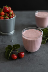 Two glasses of strawberry smoothie. Strawberry milkshake