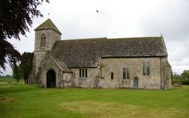 Fototapeta na wymiar The medieval St. Peter's Church at Poulshot, Wiltshire, England, UK.