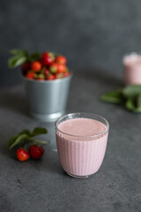 Two glasses of strawberry smoothie. Strawberry milkshake