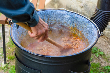 cooking goulash outdoors