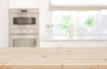 Empty wood table top and modern blurred kitchen window background