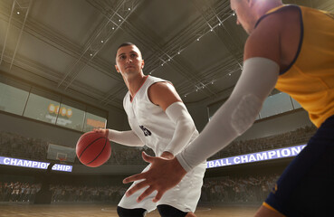 Basketball players on big professional arena during the game.