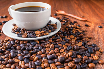 Coffee cups and coffee beans on a wooden table