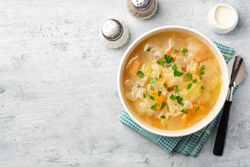 Homemade cabbage soup in bowl on concrete background - obrazy, fototapety, plakaty