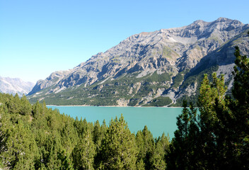 Fototapeta na wymiar Lake Cancano is an artificial water basin adjacent to Lake San Giacomo in the Fraele valley in the municipality of Valdidentro near Bormio.