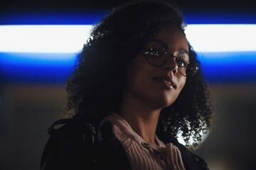 Black  girl portrait in night city lights