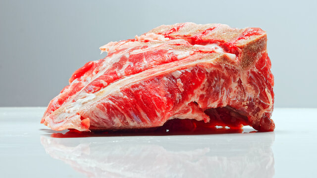 Fresh Raw Meat On Bone Isolated On White Image Series.