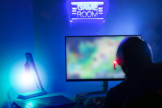 Young gamer playing with the best war game. New technology game trends and entertainment concept.