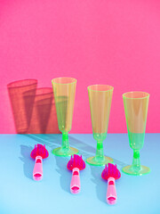 Plastic tableware isolated on pastel blue and pink background