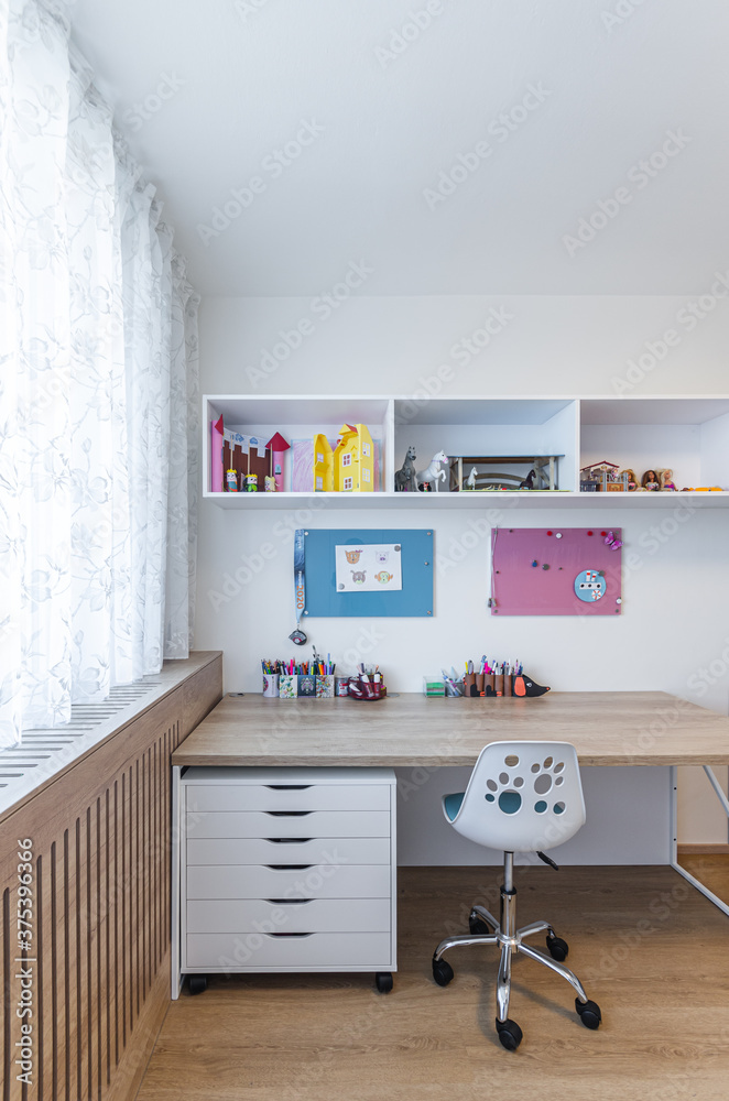 Wall mural children's room with table, wardrobe and toys