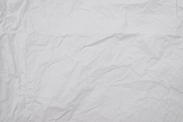Crumpled white paper background.