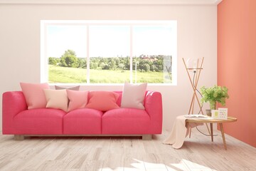 Coral stylish minimalist room with sofa and summer landscape in window. Scandinavian interior design. 3D illustration