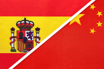 Spain and China or PRC, symbol of two national flags from textile. Partnership between European and Asian countries.