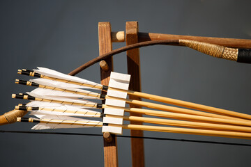 bow with arrows on a gray background. close-up