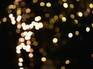 glowing yellow lights out of focus in the dark