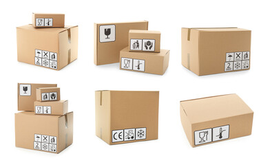 Set of cardboard boxes with packaging symbols on white background