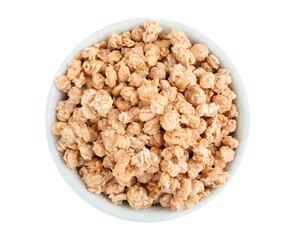 Tasty crispy granola in bowl isolated on white, top view