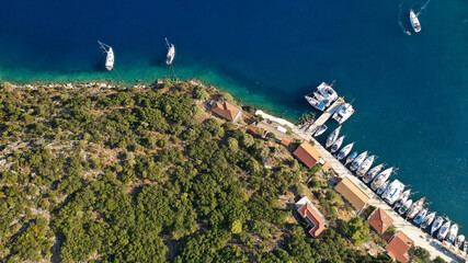 Aerial drone photo of picturesque beautiful seaside village of Kioni a safe anchorage for yachts...