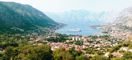 Fototapeta premium Panoramic view of the Bay of Kotor - one of the most beautiful places on the Adriatic Sea, Montenegro. It is a preserved Venetian fortress, old tiny villages, and picturesque mountains.
