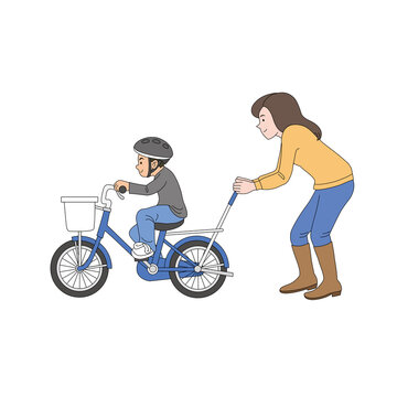 息子の自転車練習を手伝うママ