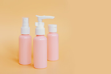Pink plastic bottles containers for cosmetics, soap, shower gel, cream