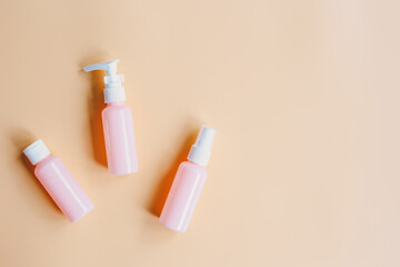 Pink plastic bottles containers for cosmetics, soap, shower gel, cream