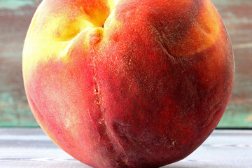close-up organic fresh peach on background