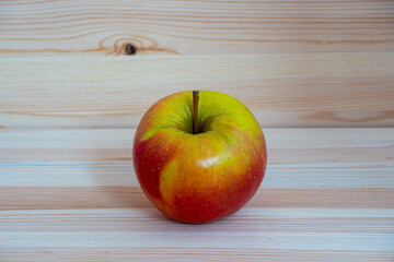 Red fresh apple on wood table