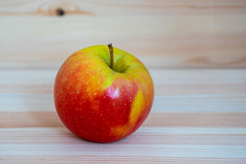 Red fresh apple on wood table
