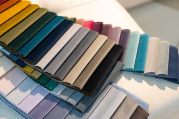 Catalog of multi-colored fabric samples. Textile industry background. 