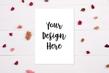 Blank paper sheet copy space with mockup and flower dry on white background, poster and invitation, postcard decoration your design or branding, simplicity and minimal, nobody, flat lay, top view.