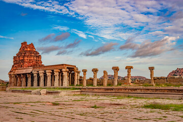 vithala temple hampi ruins antique stone art from unique angle with amazing blue sky