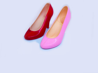 The shoes are made of dark chocolate on white background