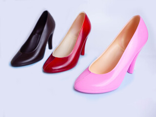 The shoes are made of dark chocolate on white background