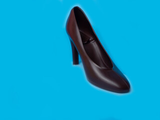 The shoes are made of dark chocolate on blue  background