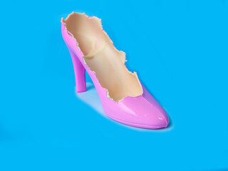 Shoes made with The chocolates were bitten away. on blue  background