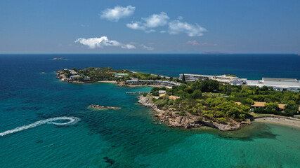 defaultAerial panoramic view of famous Grand Resort Lagonisi or Lagonissi paradise peninsula and beach with pool facilities in exotic peninsula, Athens riviera, Attica, Greece
