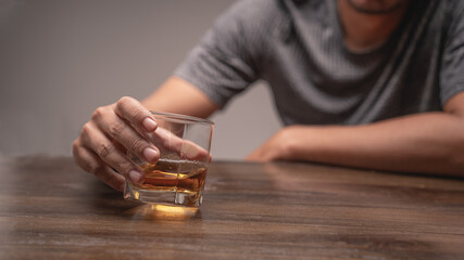 A man with a glass of wine in hand