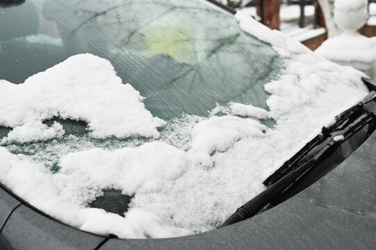 melting snow on a car windshield