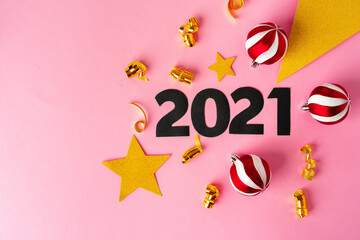 Concept of the year 2021. Golden stars with 2021 numbers on paper background