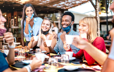 Friends group drinking cappuccino at coffee bar - People having fun together at cafeteria with face...