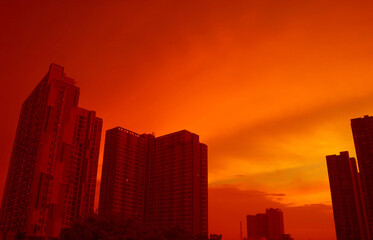 City skyline at sunset in pop art style vivid orange red color
