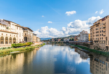 Obraz premium View of the Arno river and St Trinity bridge designed by Bartolomeo Ammanati and reconstructured after World War II in Florence, Italy
