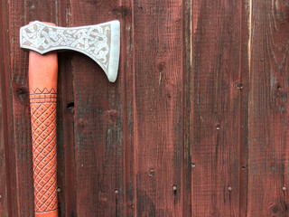 axe with patterns on a background of brown boards