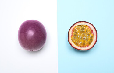 Fresh ripe passion fruits (maracuyas) on color background, flat lay