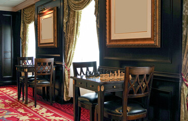 Chess board for playing games in cozy and comfortable living room atmosphere in lounge of luxury...