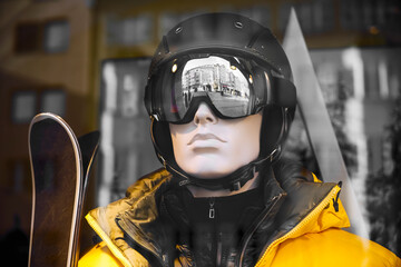 Mannequins equipped for skiing in a ski equipment shop. yellow modern jacket. dummy in the window