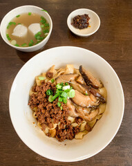 Dry Chili Bainman or Dry Chili Pan Mee from Chow Kit in Kuala Lumpur, Malaysia. Thick flat stir fried spicy noodles with Hakka cuisine roots.
