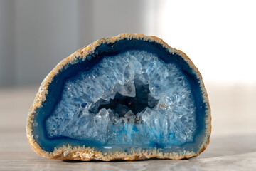 Geode with crystals of light-blue color. Quartz geode with transparent crystals. . - obrazy, fototapety, plakaty