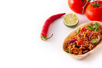 Mexican barquita taco with beef, chilli, tomato, onion and spices isolated on white background. Copy space